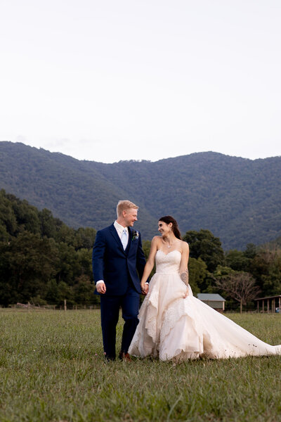 couple walking in grass