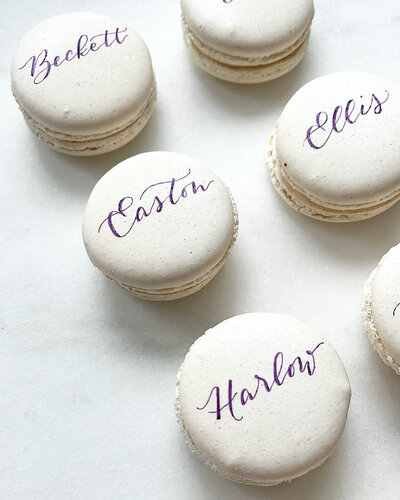 Personalized macaron place cards with calligraphy