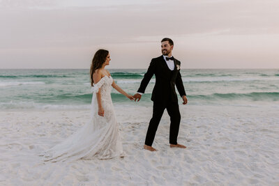 newlyweds touching hands