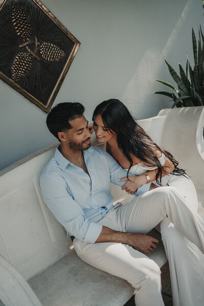 smiling couple cuddling engagement session