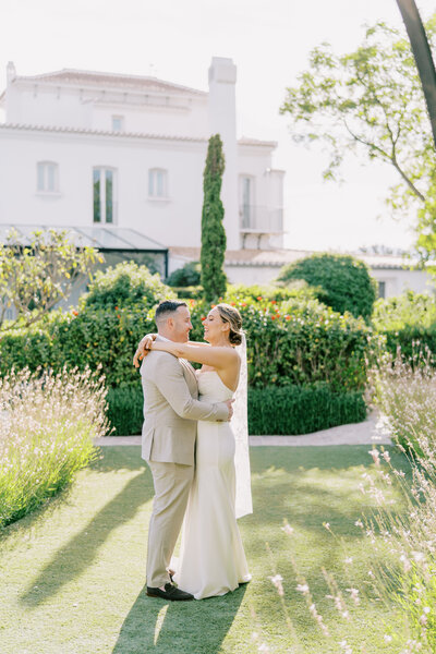 Light and airy wedding portrait at sunset in Missouri vineyard