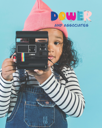 A child in a pink hat and striped shirt holds a vintage instant camera, with "Dower and Associates" in colorful text on a blue background, highlighting playful brand design by Sweet Pea Ink Creative.
