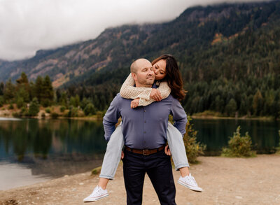 Fun, candid moment during an outdoor engagement session at Gold Creek Pond in Snoqualmie Pass, WA.