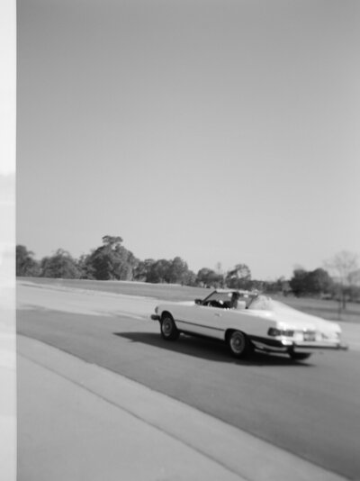 natural candid film wedding photography, couple driving away in vintage wedding convertible car, Detroit