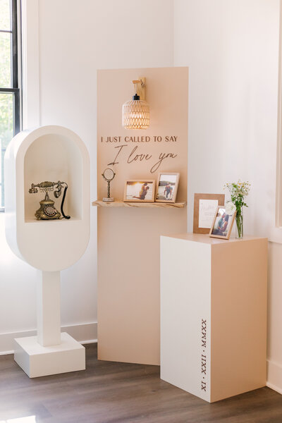 Modern wedding guest book alternative featuring a vintage phone guests use to record voice messages, displayed on custom signage built by Cove Mill Design Co. reading ‘I just called to say I love you.’