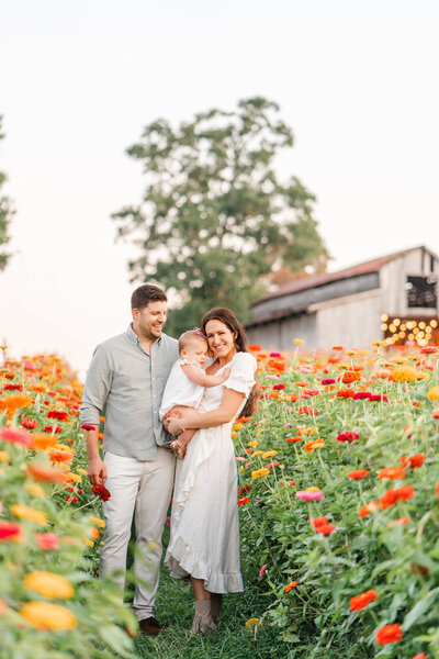 Family poses in Zinnia field during Chattanooga photography session, Family photographer Chattanooga, TN