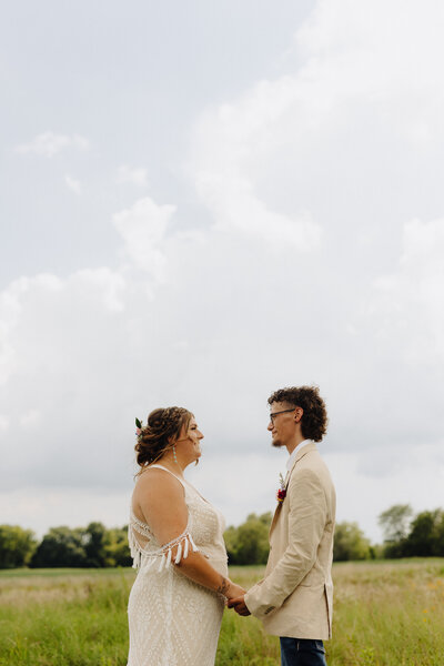 couple close together with lanterns behind them