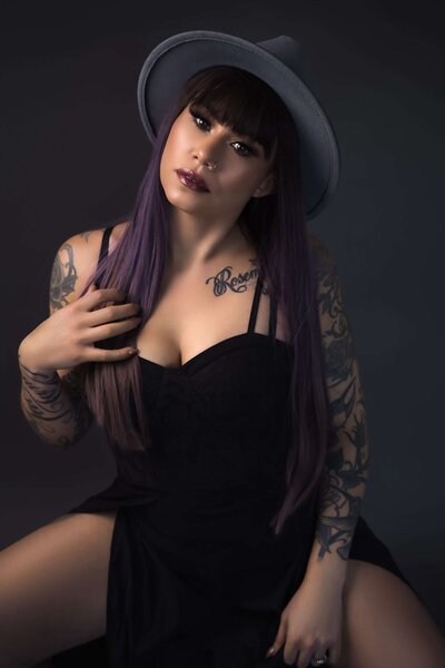 A woman with tattoos poses for a closeup during a vancouver Boudoir Photoshoot