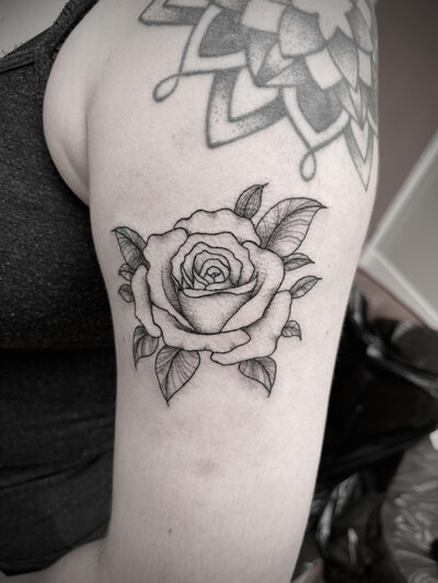 Fine line floral tattoo by Vamp Ink'd