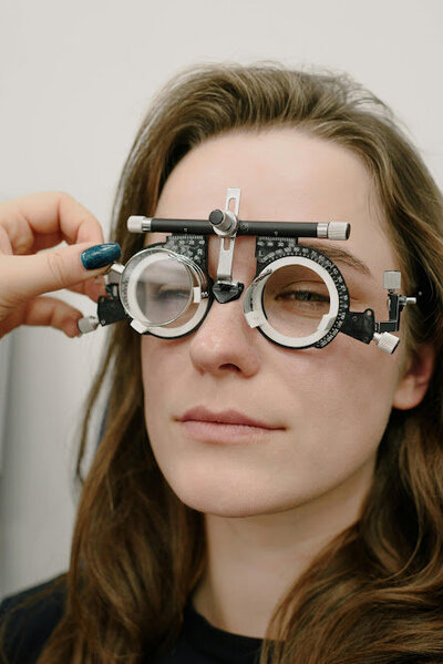 woman receiving an eye exam at doctors office