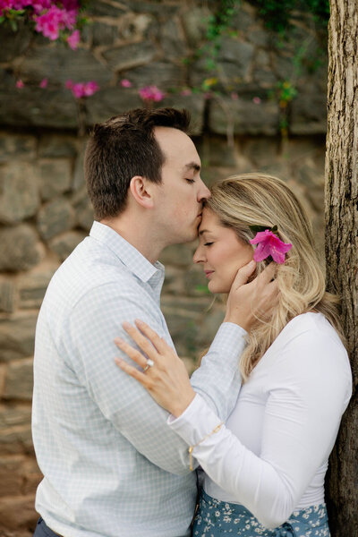 man kissing fiance atlanta engagement session
