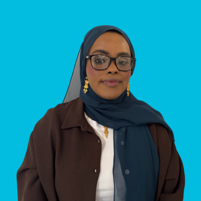 woman therapist at move forward who is wearing blue hijab and brown shirt