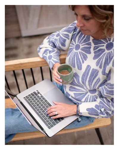 Jaime with laptop and coffee
