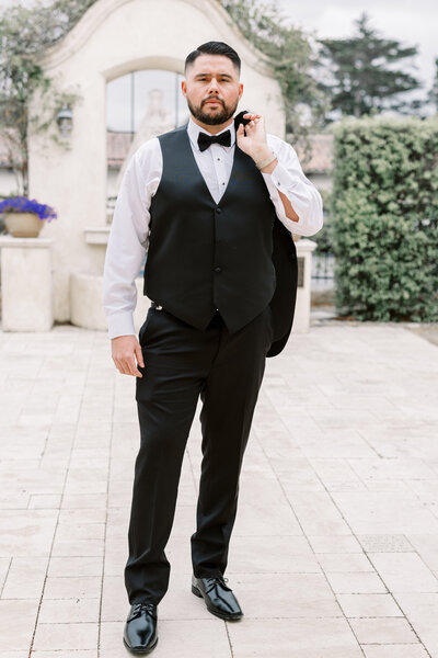 A groom at the San Carlos Cathedral getting ready to get married in Monterey, CA
