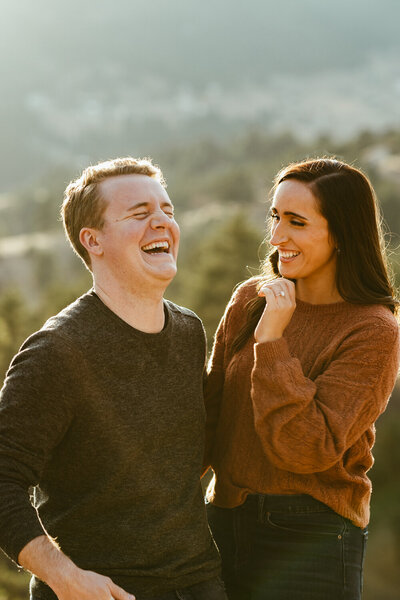 Engaged couple share a laugh