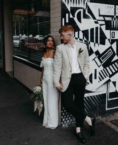modern bride and groom outside fitzroy venue on the corner