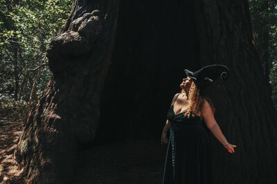 Spiritual CEO business coach Rachael Maddox, in the forest, guiding world-changing leaders to thrive at their edge through Business Witchery's CEO Coven.
