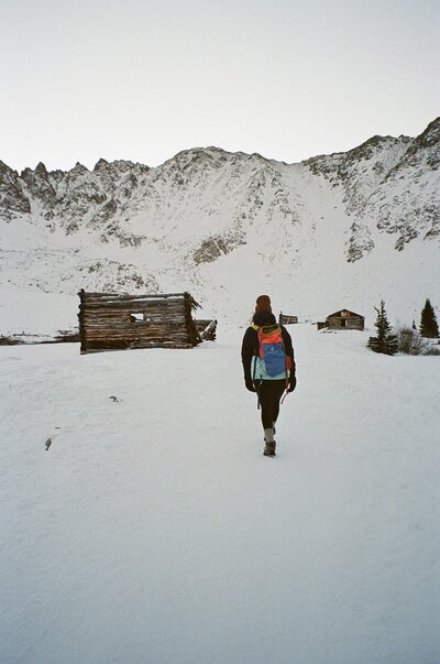 woman walking to mountains