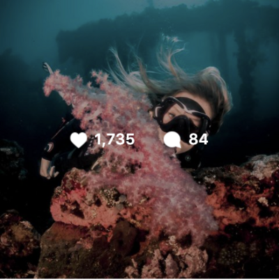 Scuba Diving blonde girl with pink coral instagram post with 1700+ likes