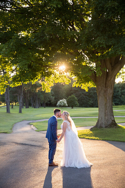 bride and groom in sunflowers at Dyments Glen Drummond Farm