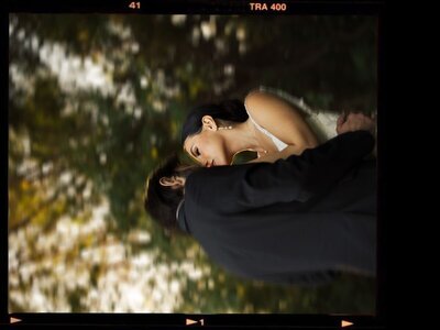 Bride and groom in forest. Artistic wedding portrait with subtle motion blur