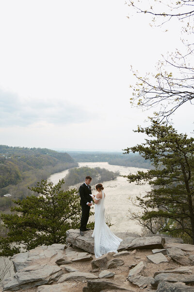 A bride and a groom between two trees during their wedding ceremony in Austin, Texas. 