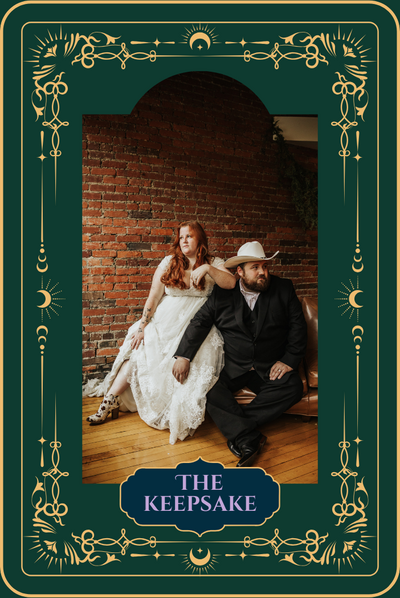 Bride in lace gown and groom in suit with cowboy hat posing against rustic brick wall at Ohio wedding.