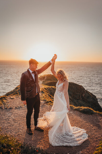 couple spin in golden sunlight