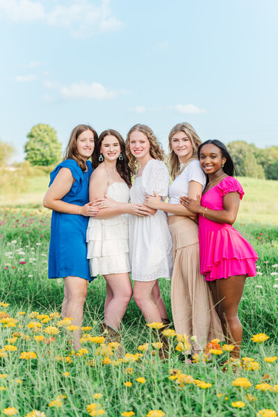 Senior spokesmodel team in wildflower field