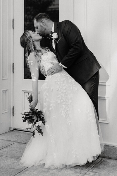 Husband dips his new bride