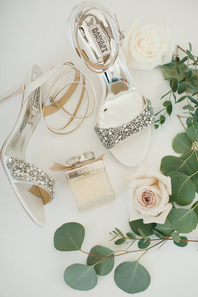 Jeweled Wedding Shoes, Perfume and Pink & White Roses on White Background