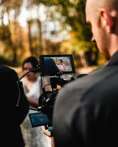 Alex, a State College, PA wedding videographer, filming a couple’s vow reading at The Manor on Saw Mill in Mechanicsburg, Pennsylvania.