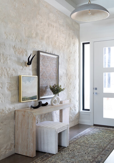 Dining room with white brick walls and chandelier