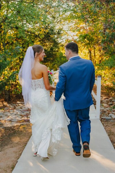 bride and groom holding hands at dallas texas wedding