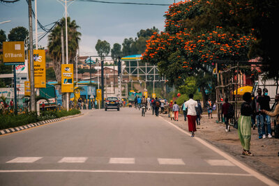 A woman and other locals walking along the street of Ruhengeri, Rwanda