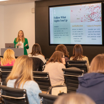 Shannon Russell speaking at an event about women's empowerment and building successful businesses. 