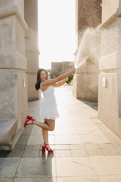 Kylie graduating college, and popping champagne to celebrate