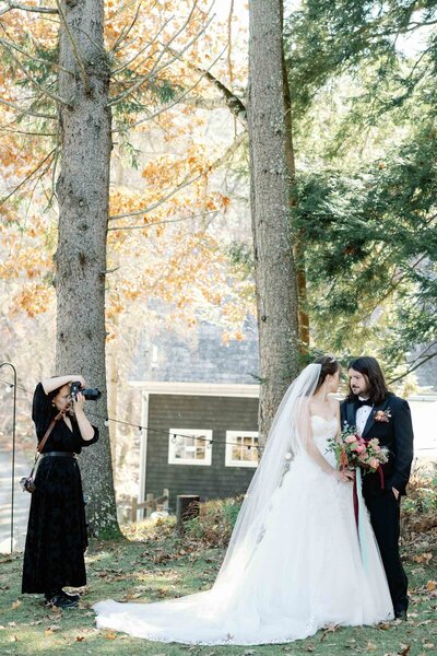 Photographer documenting romantic moment with bride in stunning marchesa gown at black tie wedding vt