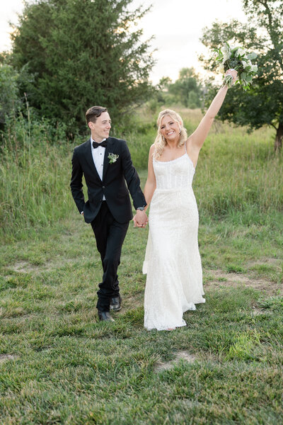 Couple celebrating on wedding day.