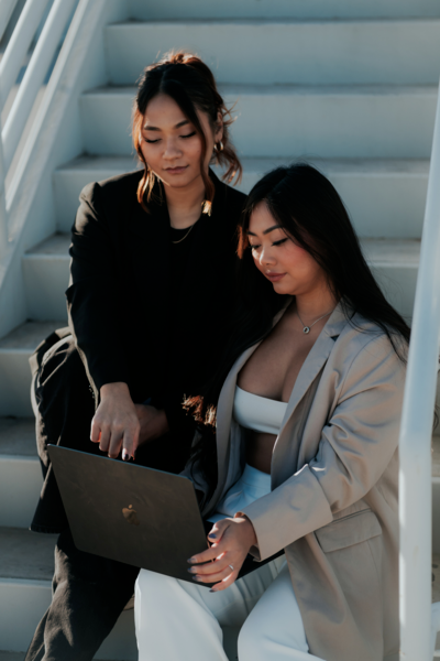 Kemotion co-owners collaborating on a Showit website design for service-based businesses.