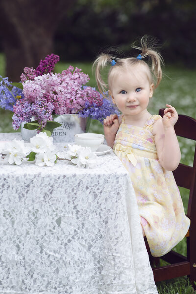 Girl at tea party with flowers
