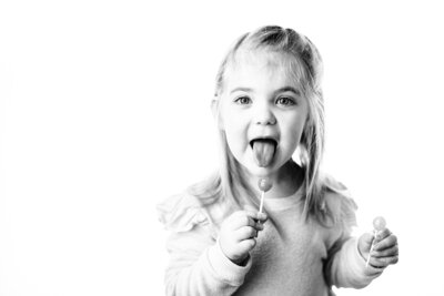 black and white portrait of child, fun and silly personality portrait in East Jordan studio