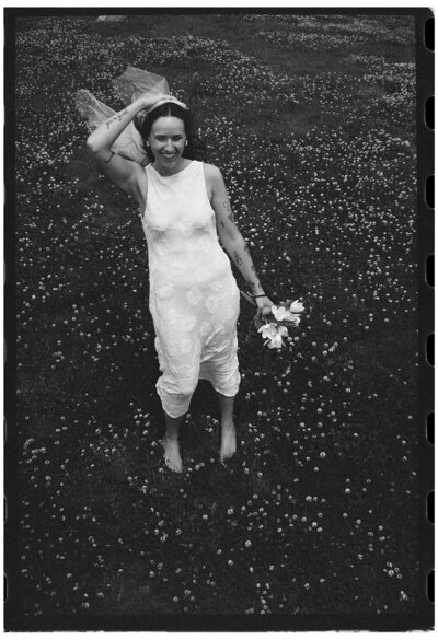 Bride in field taken by wedding photographer tampa fl