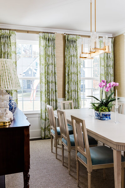 Classic timeless dining room design with patterned curtains