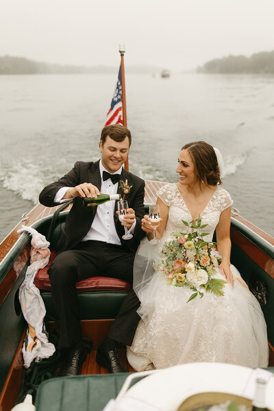 couple in boat by destination and raleigh wedding photographer