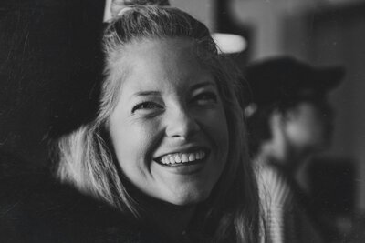 a young women smiling and talking to a therapist