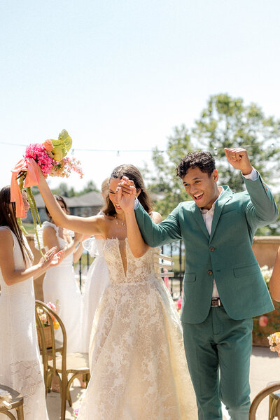 Bride and groom cheering at the Club Corazon  in Dublin, Ohio