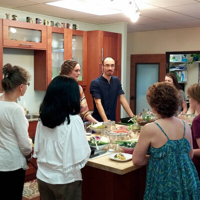 This photo captures Dr. David Morcom, PharmD., in a kitchen environment, passionately educating clients about the intricacies of nutrition and natural medicine. With over a decade of experience in pharmacology, Dr. Morcom combines scientific knowledge with advanced technology and intuition to create personalized wellness plans. He is dedicated to empowering clients with the knowledge and tools for sustainable health through diet and lifestyle education.