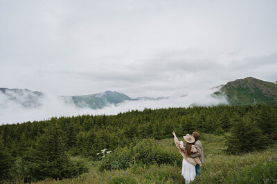 Couple kissing with the mountains in the background