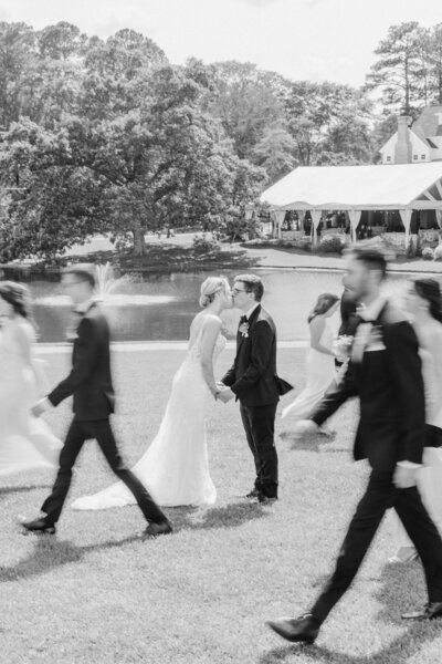 Bride holding her bouquet with her groom in Wilmington, NC